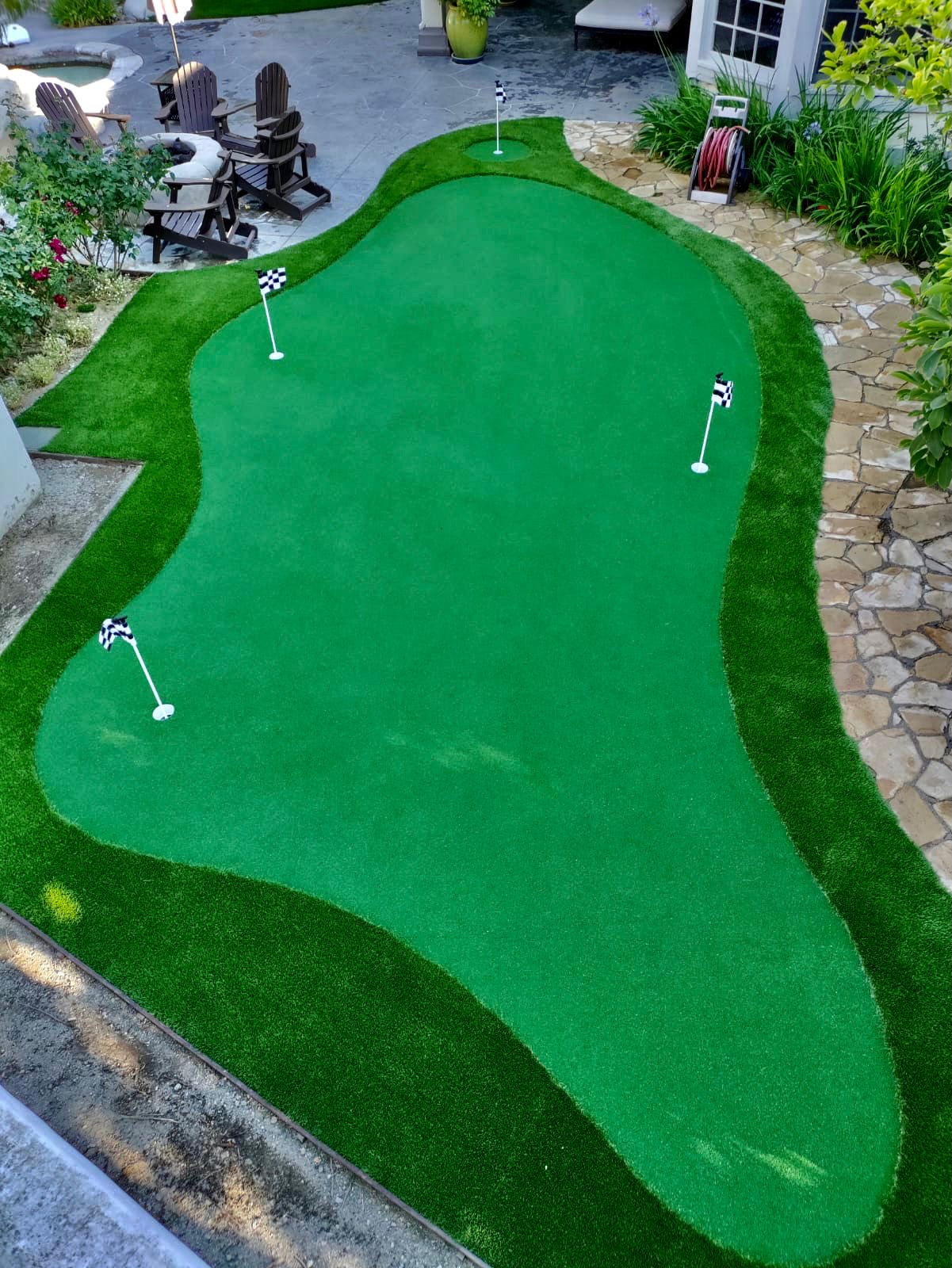 Large putting green with stone walkway