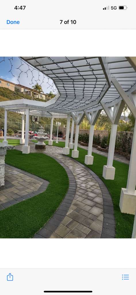 Pergola with paver pathway and turf landscaping